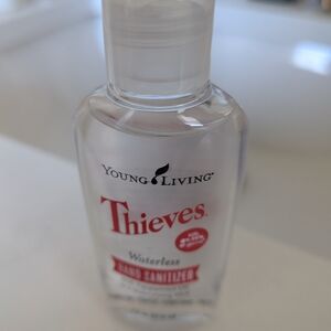 Young Living Thieves Hand Sanitizer with Red and Black Text